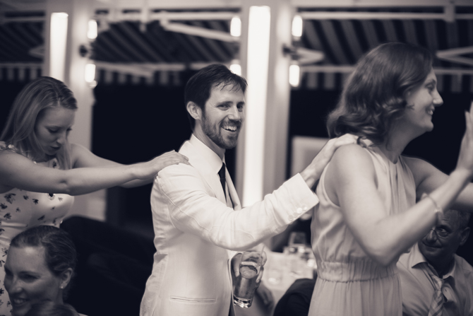 Groom dancing at reception